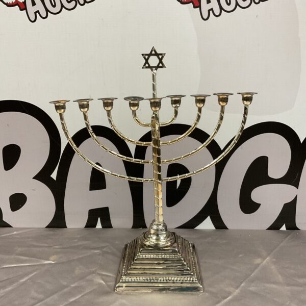 Silver plated Hanukkah menorah with Star of David finial.