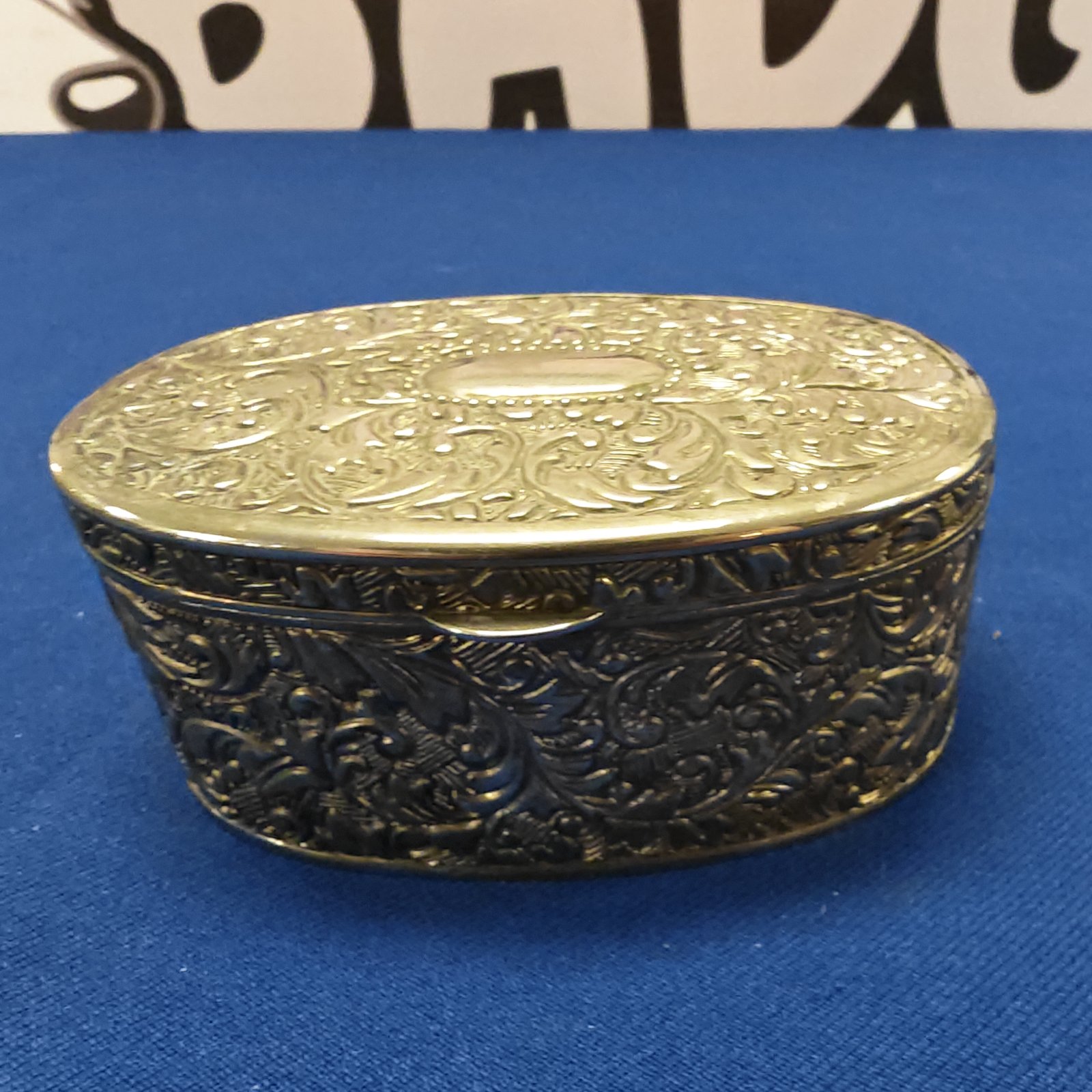 Intricate silver plate trinket box with Victorian detailing.