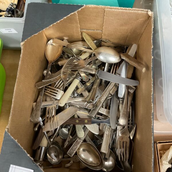 Mixed lot of vintage silver plated cutlery including forks and knives.