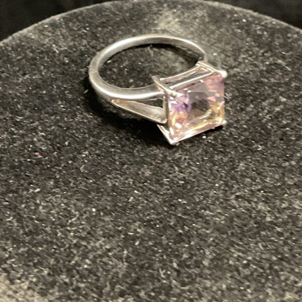 Silver ring with a square yellow stone, size O.