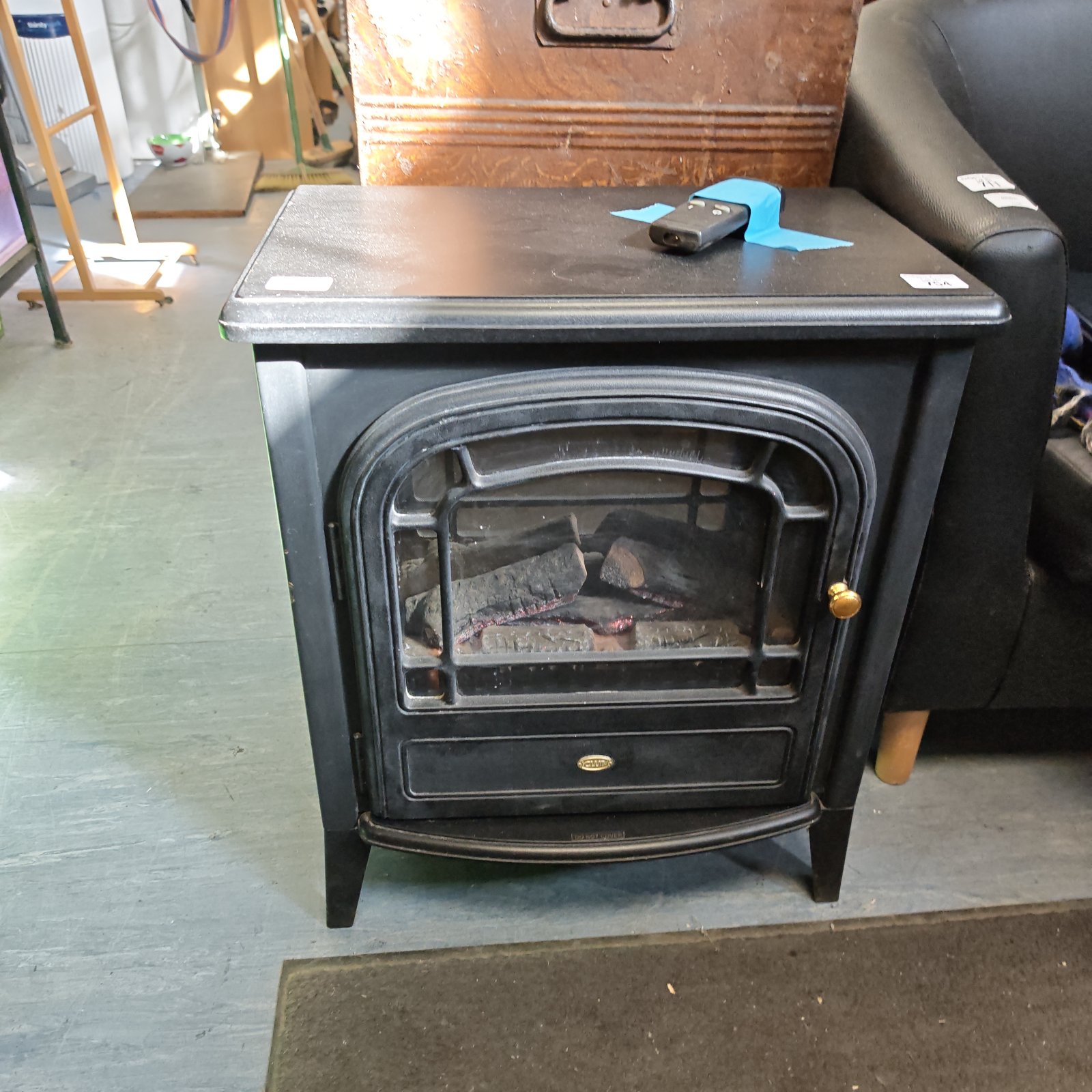Vintage Simplex electric log effect heater with log display.