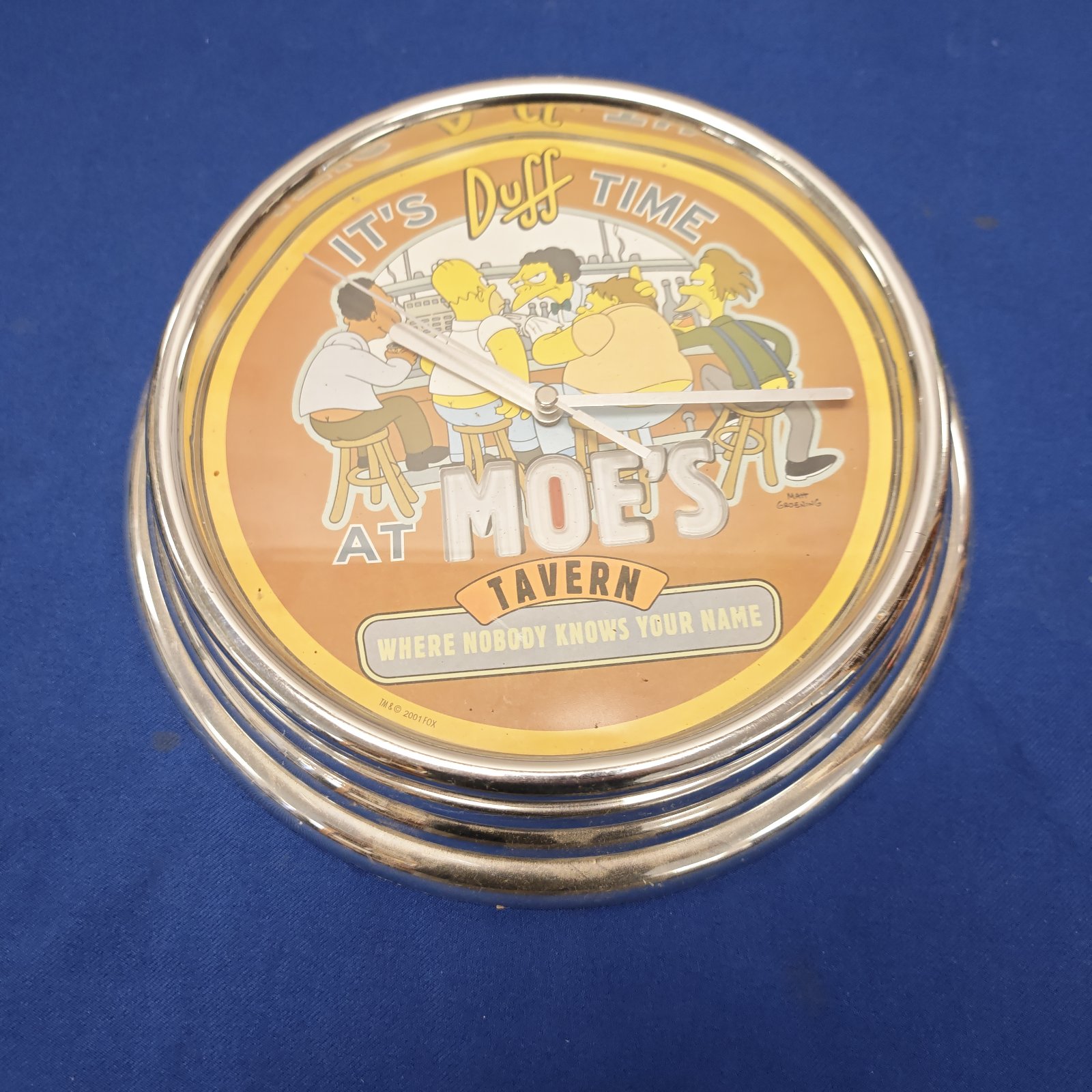 Simpsons Duff Time clock featuring Moe's Tavern imagery.
