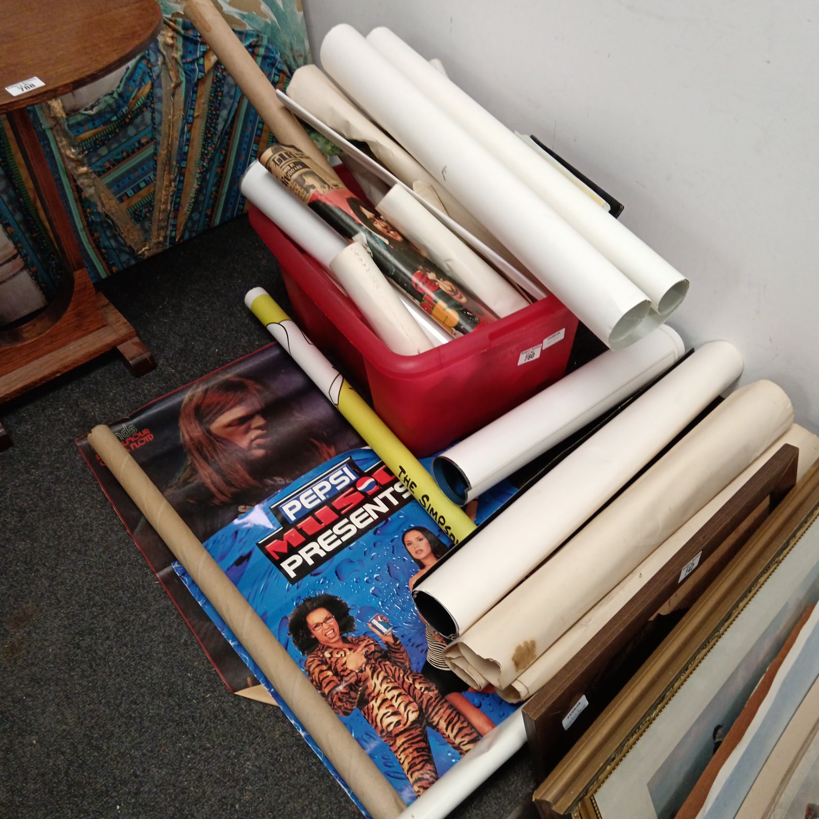 Rolled poster collection including Simpsons and Spice Girls posters.