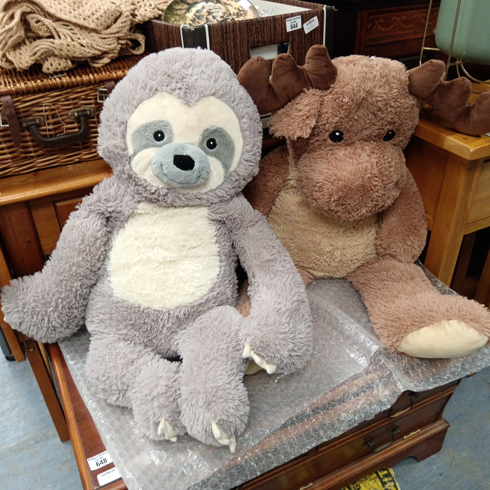 Large grey sloth and brown reindeer soft toy lot.