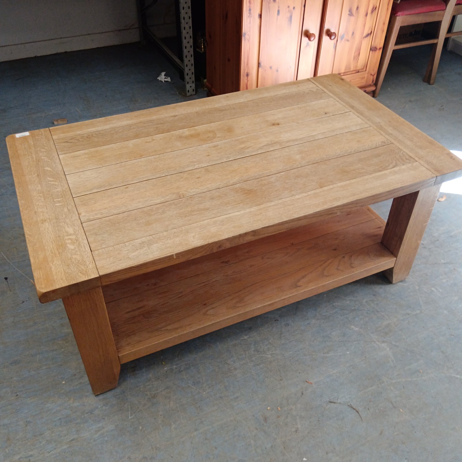 Rustic solid oak coffee table with lower shelf.