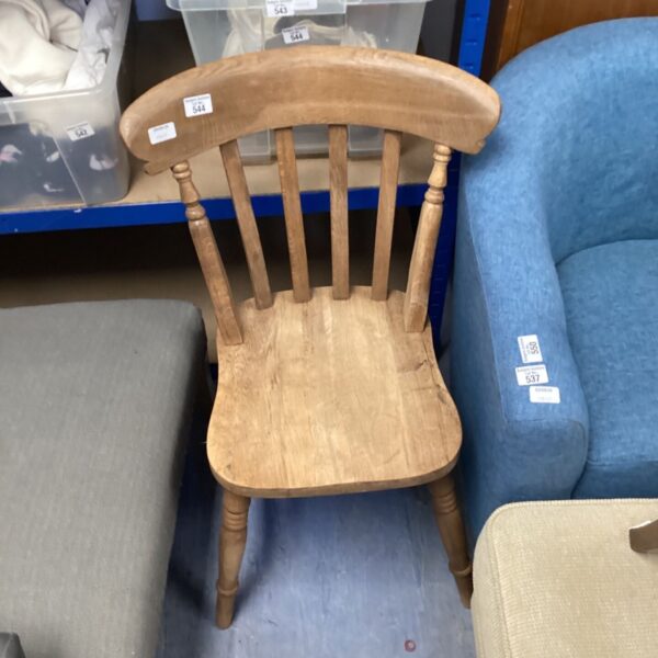 Vintage solid oak chair with spindle back, ideal for farmhouse kitchens.