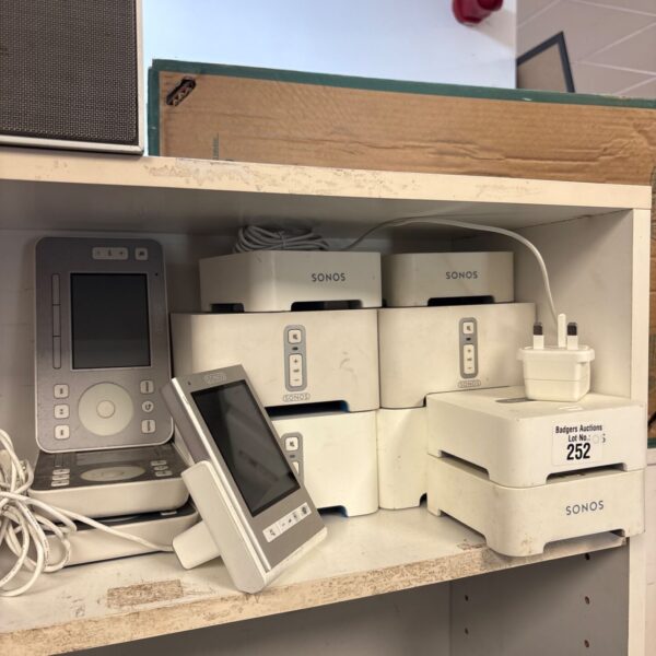 Sonos equipment lot including Zone Player, Bridge, and remote controls.
