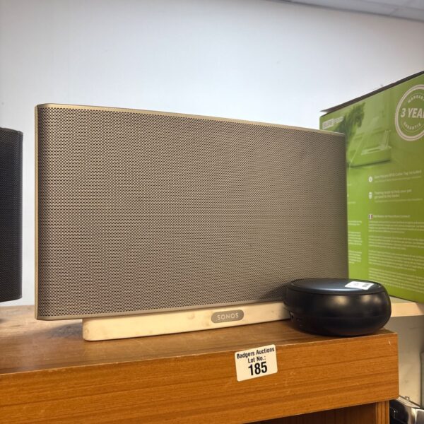 Sonos Play Five smart speaker with Samsung DeX Station, side view.