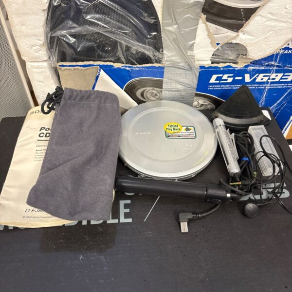Vintage Sony DEJ985 portable CD player with pouch and accessories.