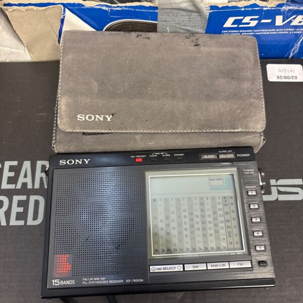 Vintage Sony ICF-7600DA receiver with case, showing front panel details.