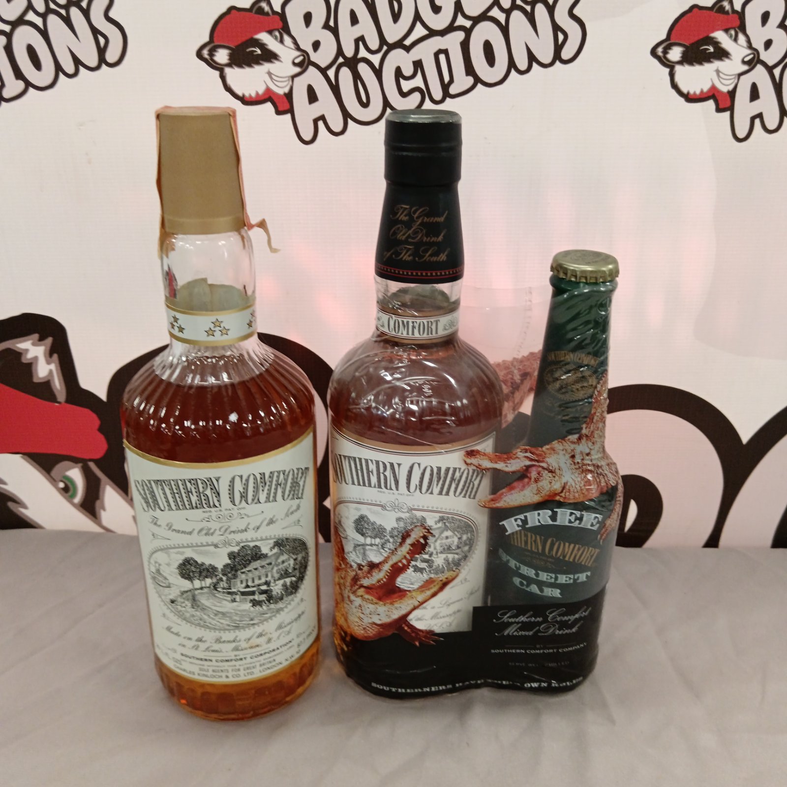 Vintage Southern Comfort bottles and a Street Car bottle for collectors.