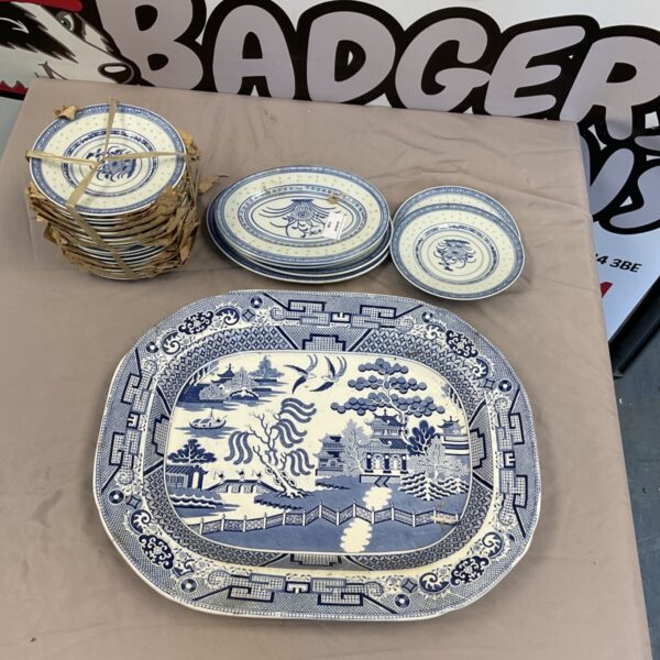 Staffordshire blue and white serving set with side plates displayed.