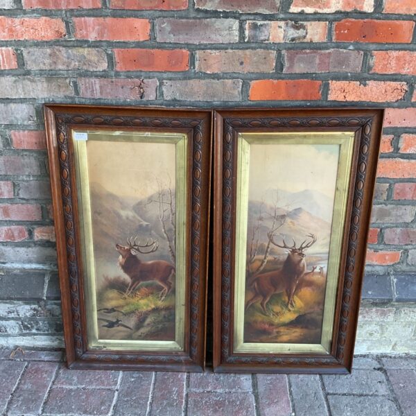 Pair of vintage stag prints in oak frames for wall decor.