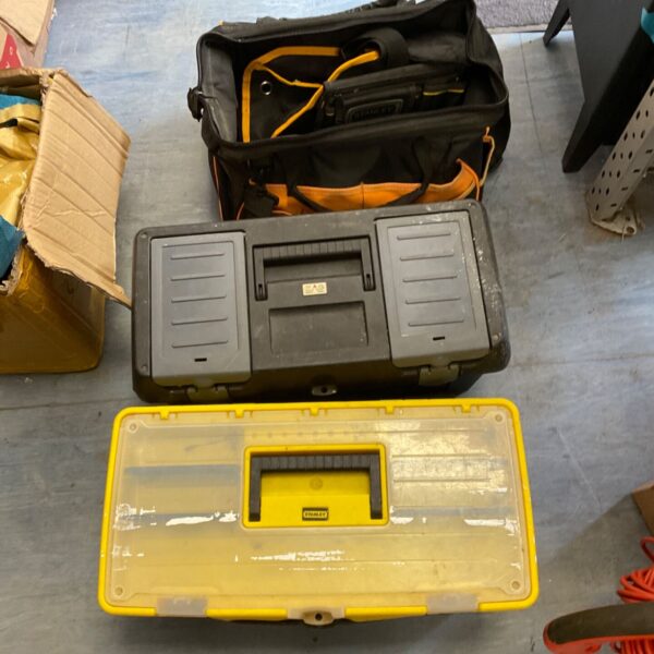 Empty Stanley and Zag toolboxes with tool bags for workshop storage.