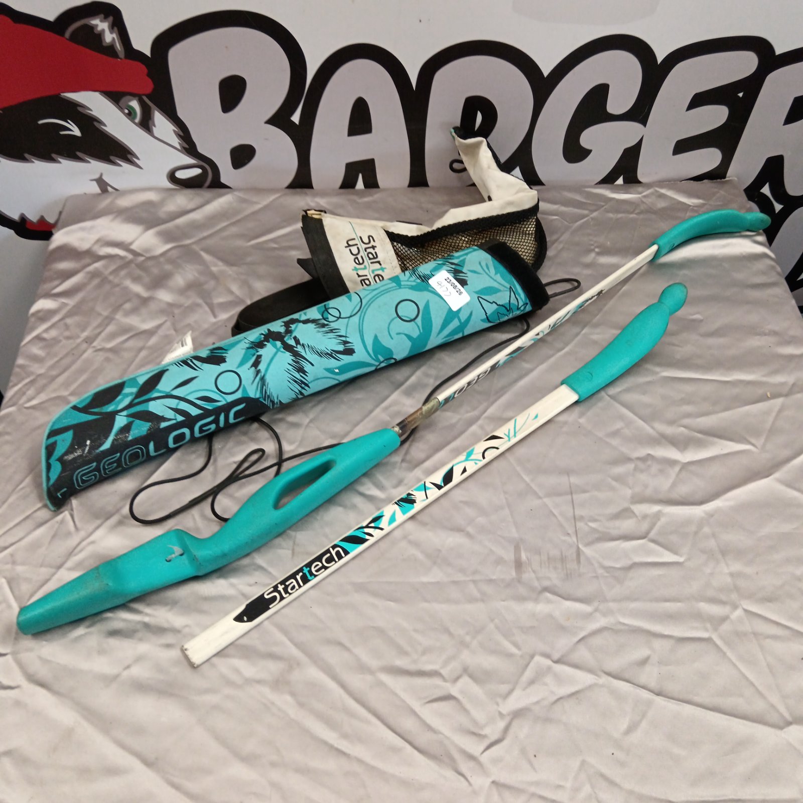 Blue Startech longbow with protective case for youth archery.