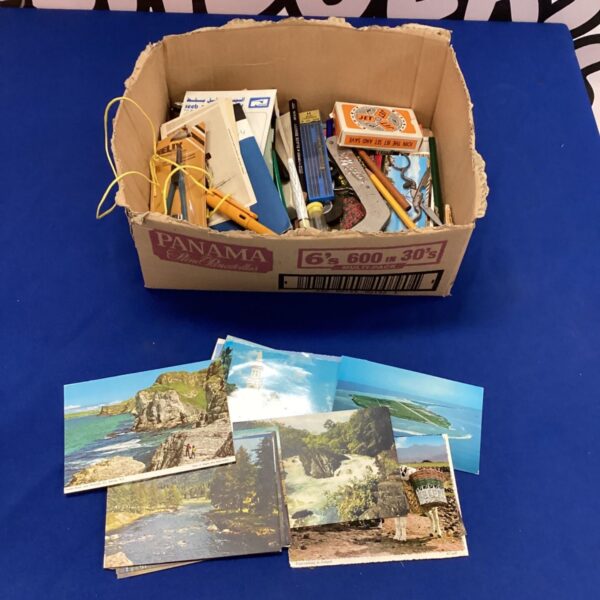 Box of vintage stationary and postcards for collectors.
