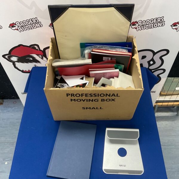 Stationery box filled with office supplies and a laptop stand.