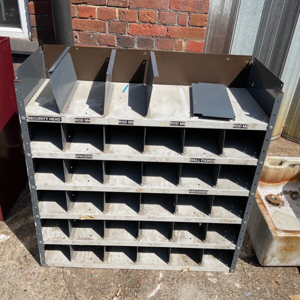 Heavy-duty steel bolt bin cabinet for hardware storage.