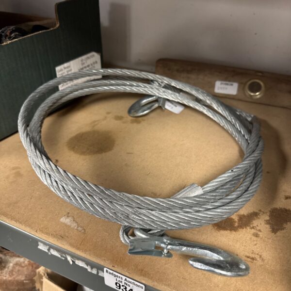 Roll of steel cable with hooks for lifting and securing.