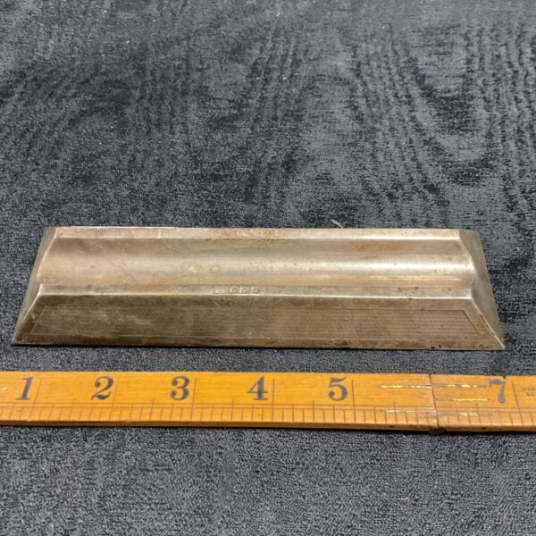 Antique sterling silver pen tray with ruler for scale.