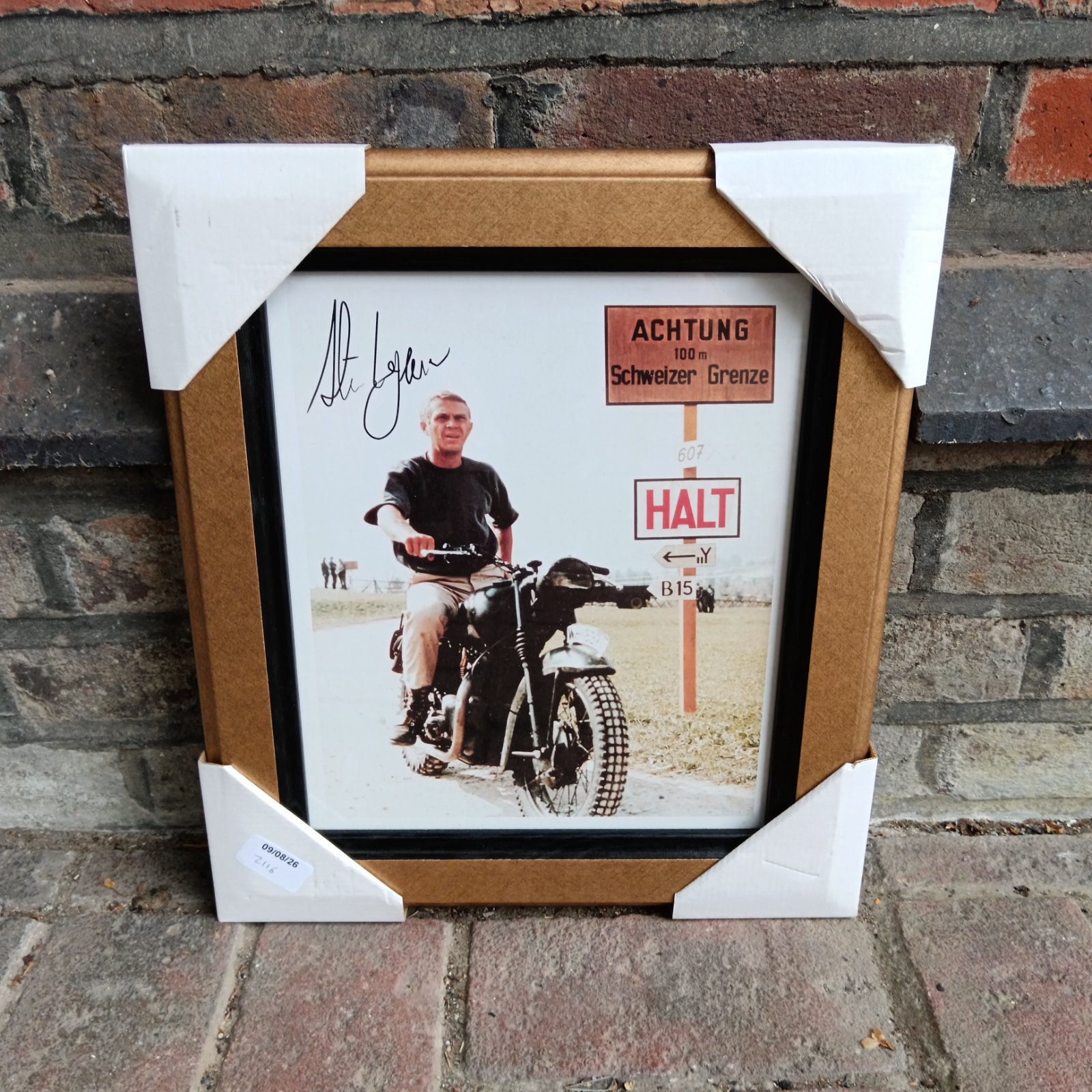 Framed Steve McQueen print from The Great Escape film on a motorcycle.