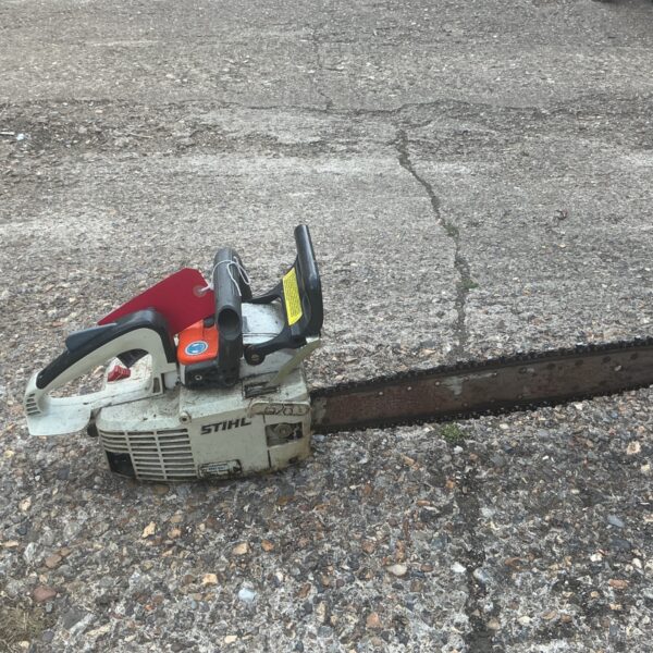 Stihl 028 petrol chainsaw in used condition, vintage garden tool.