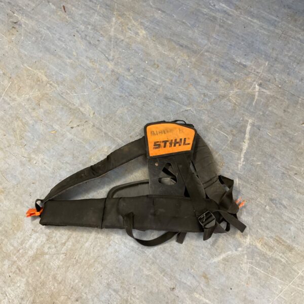 Used Stihl strimmer harness with adjustable straps and padding.