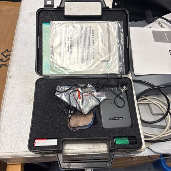 Stimate N601 TENS machine in its original case, vintage electrotherapy device.