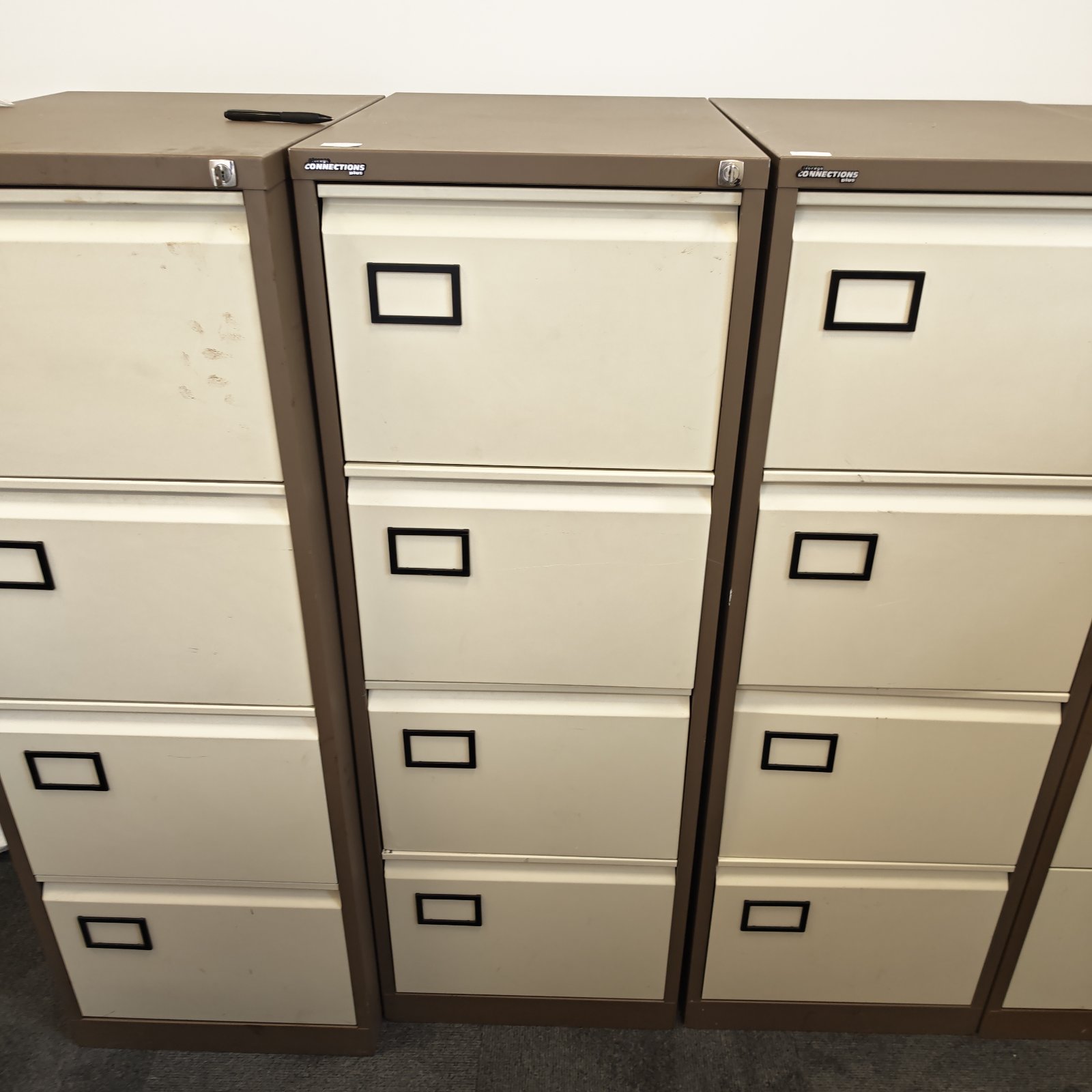 Vintage metal filing cabinet by Storage Connections with four drawers.