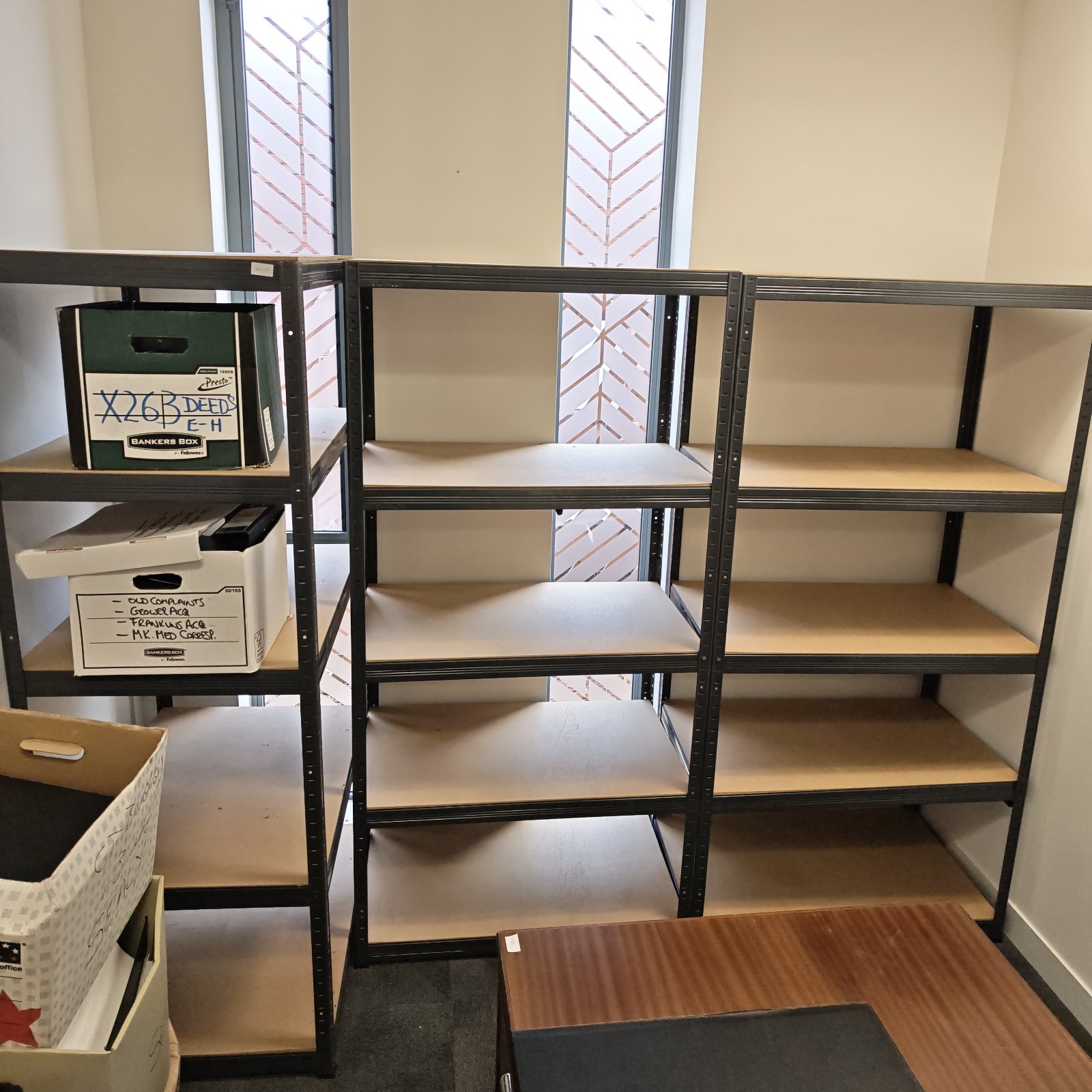 Black metal Storalex shelving unit for garage storage.