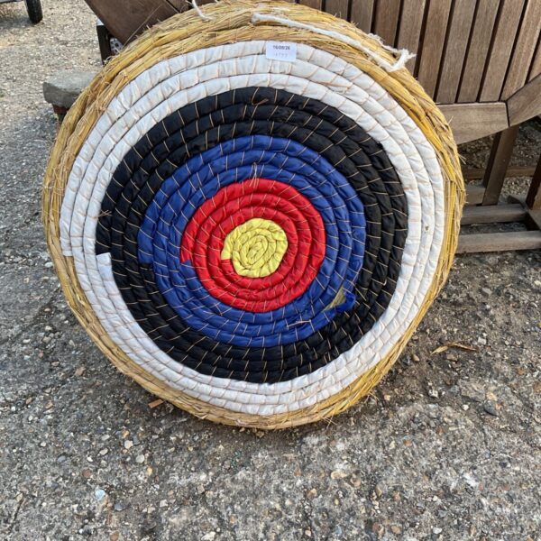 Traditional straw archery target with colorful scoring rings.