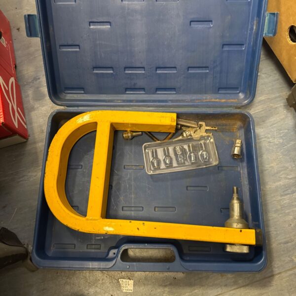 Yellow Stronghold caravan wheel clamp for trailer security.
