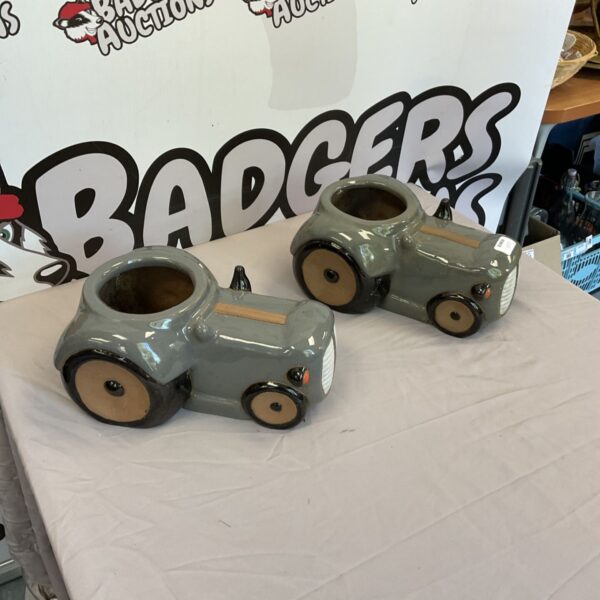 Vintage studio pottery tractor flower pots for garden decor.