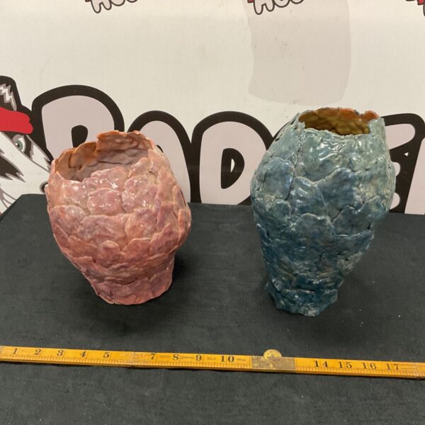 Handmade studio pottery vase with organic petal texture.
