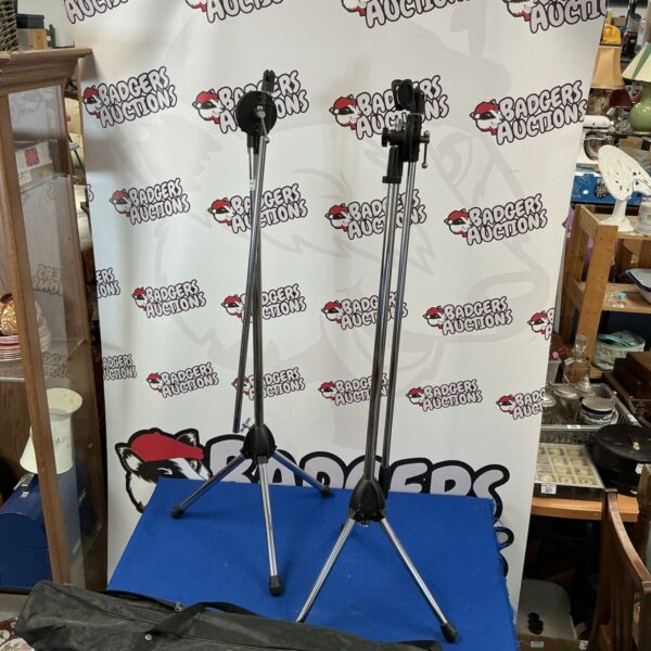 Two black StudioSpares tripods for photography lighting support.