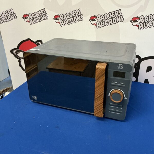 Vintage Swan microwave with enamel finish, model SM60.