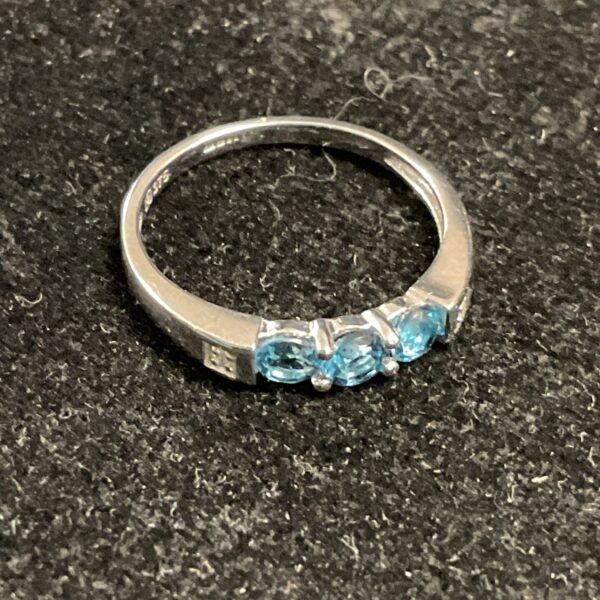 Elegant 9ct white gold ring with Swiss blue topaz and diamonds.