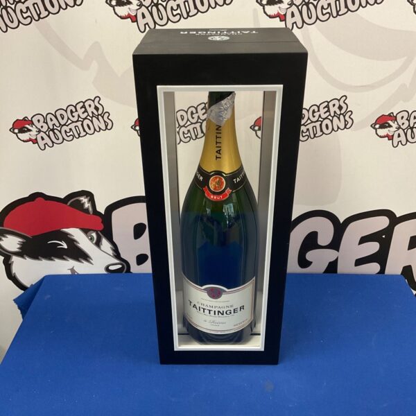 Empty Taittinger Champagne bottle in presentation case, collectible item.