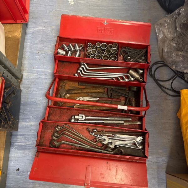 Vintage Talco metal cantilever toolbox filled with tools.