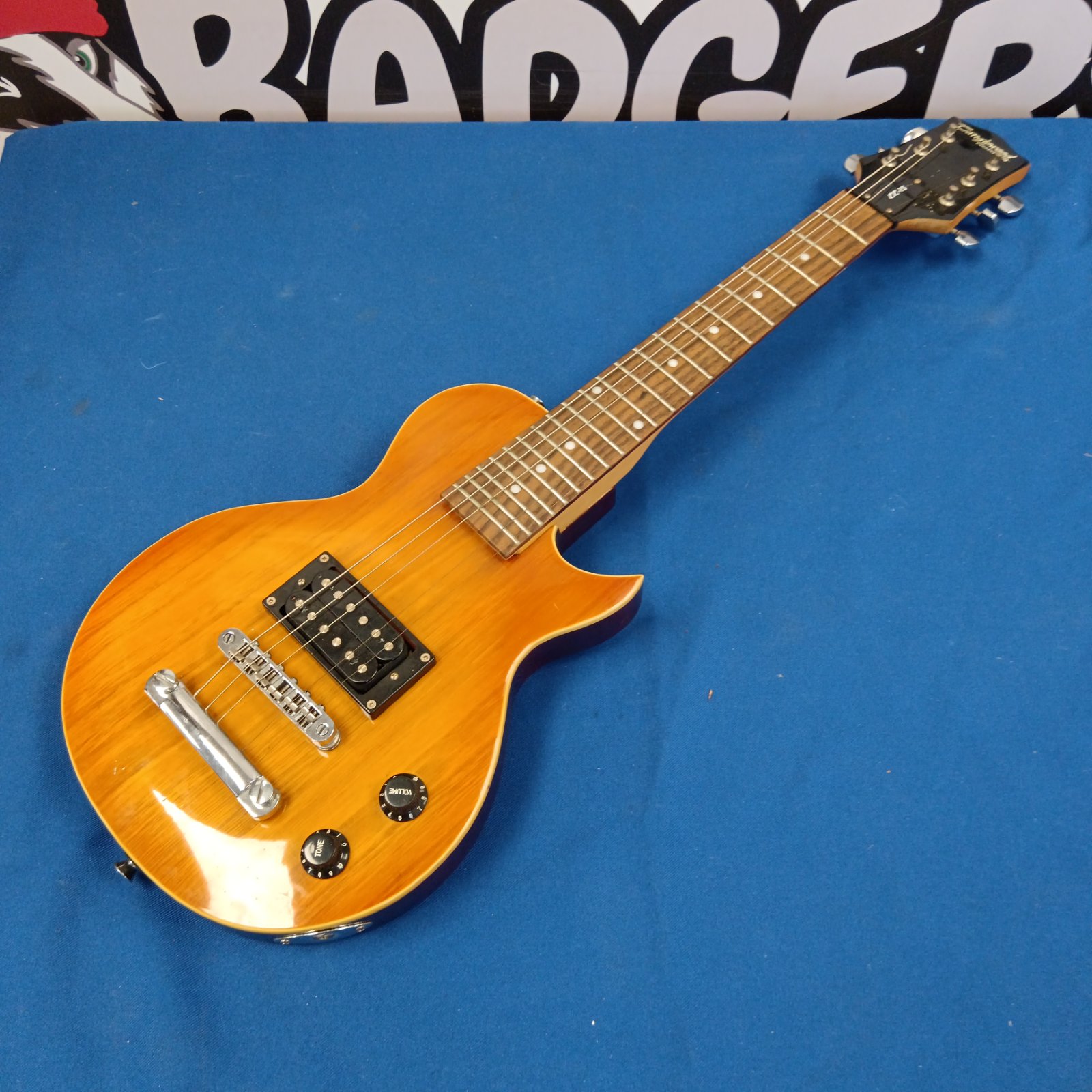 Tanglewood EE-15 electric guitar, a small beginner instrument.