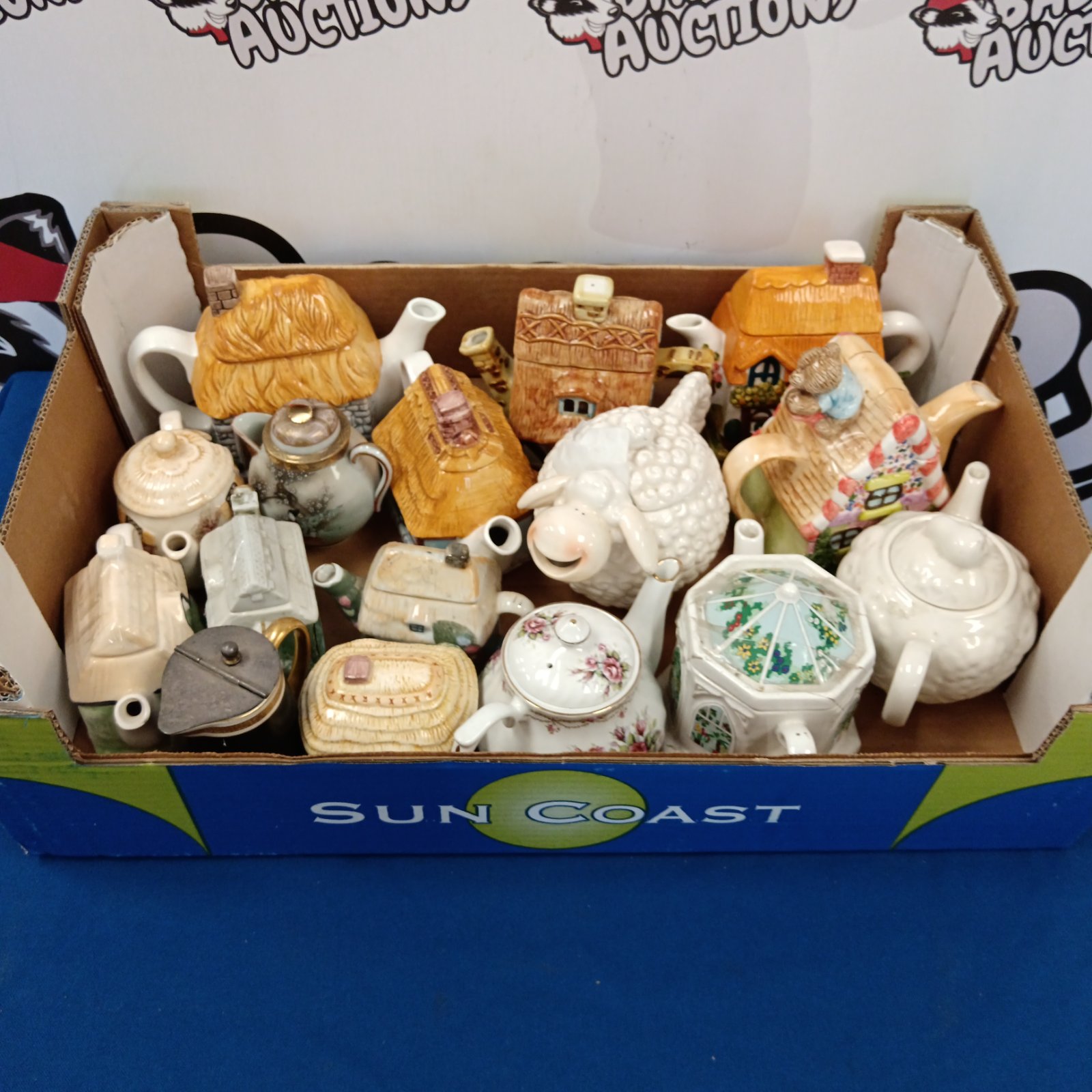 Collection of vintage teapots including Wade and cottage ware.