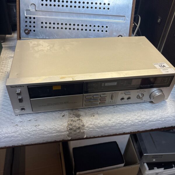 Vintage Technics M216 stereo cassette deck, front view.