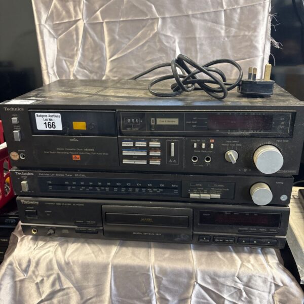 Vintage Technics stereo system with cassette deck, tuner, and CD player.