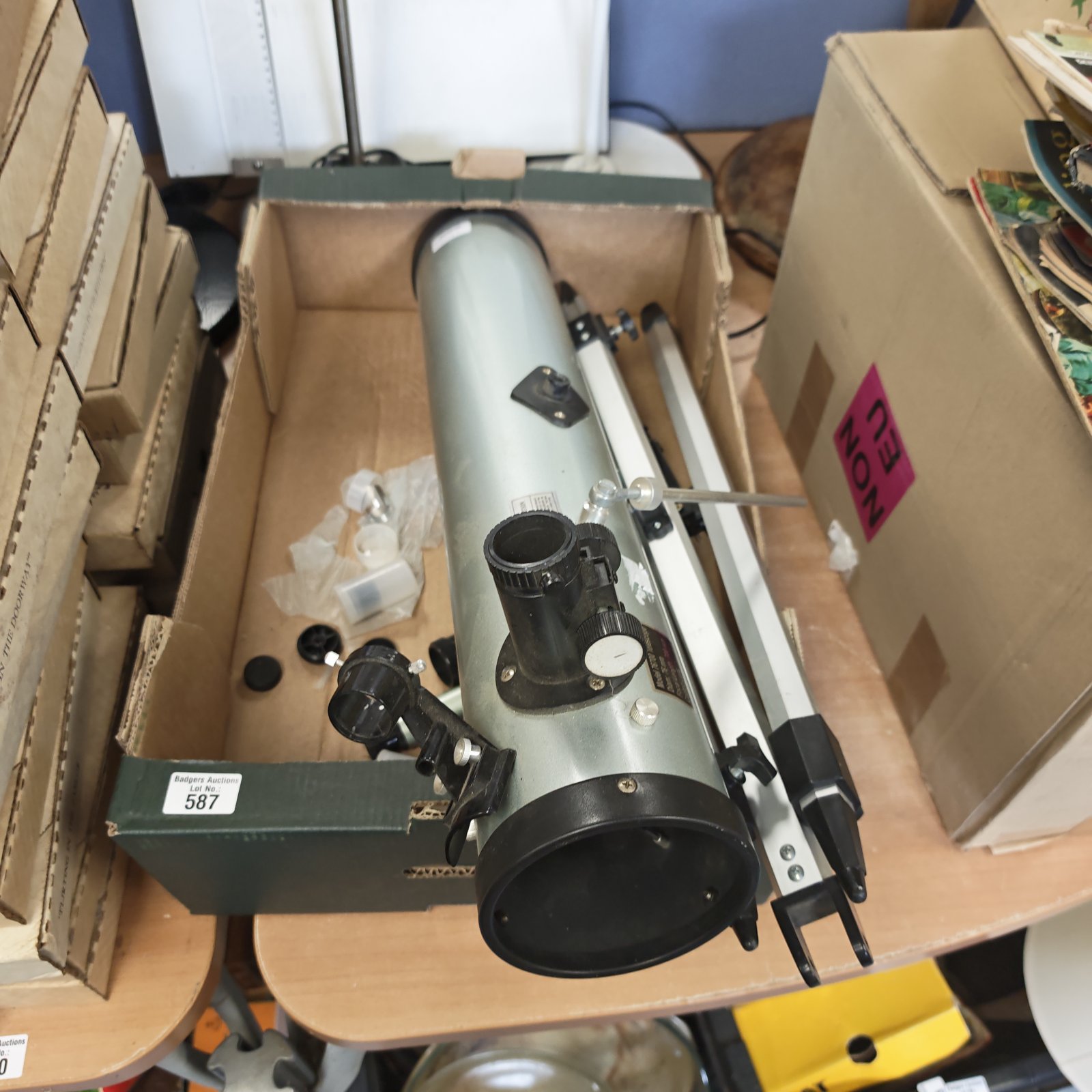 Vintage telescope on tripod, model 76700, for astronomical viewing.