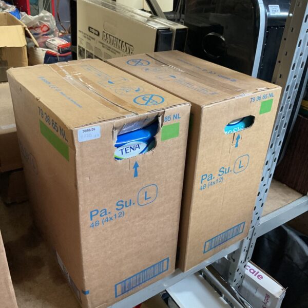 Two boxes of TENA incontinence pants in size large.
