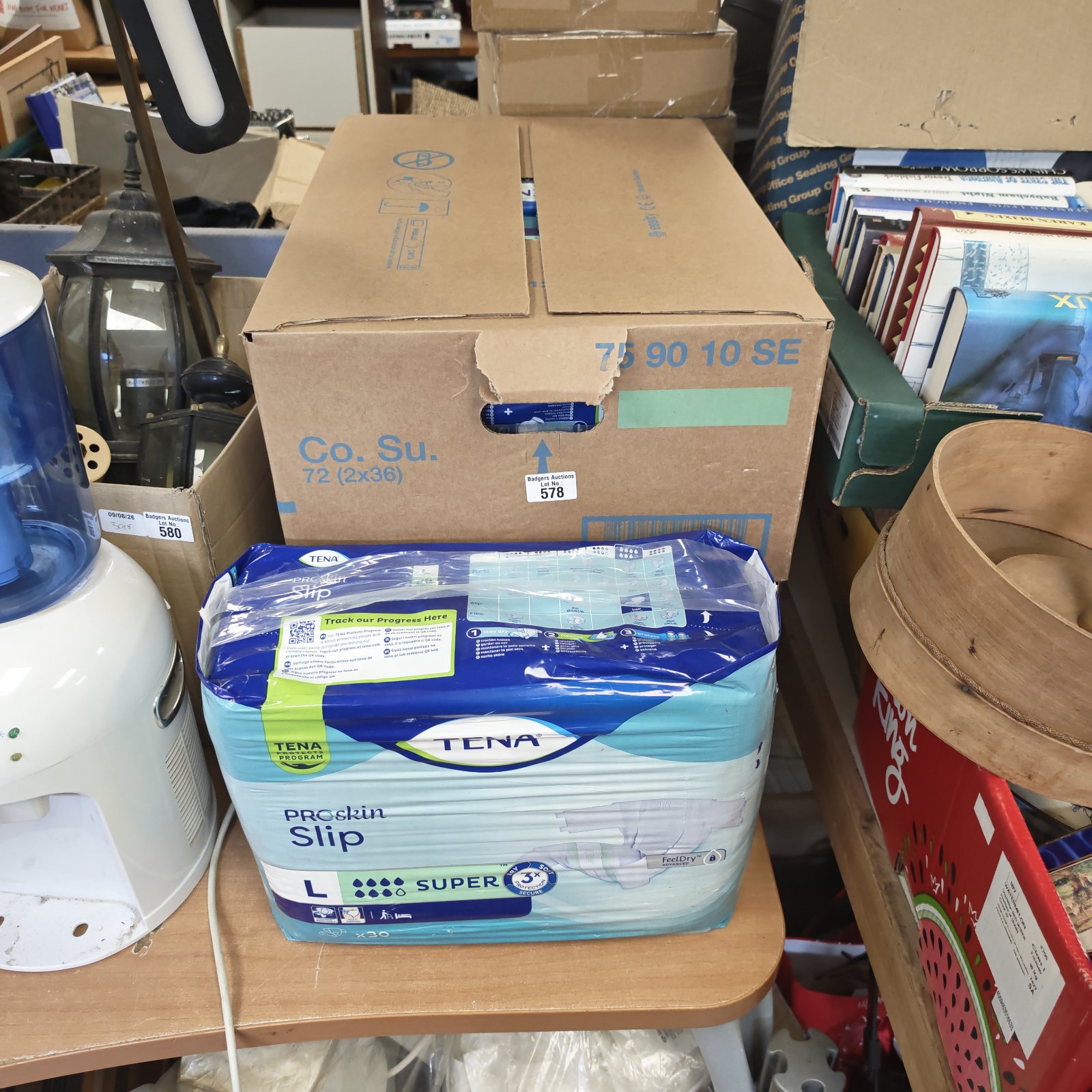 Two boxes of Tena Proskin slip pads size L for incontinence.