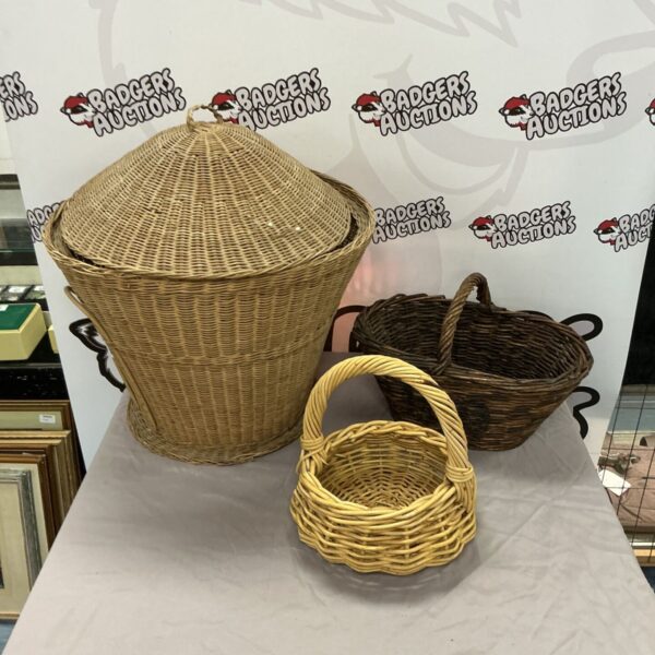 Three vintage wicker baskets for storage and display.