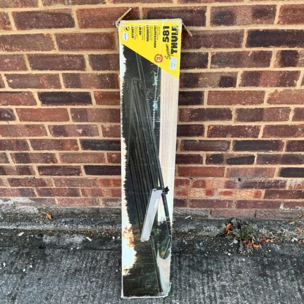 Thule 581 roof rack system for vehicle transport.