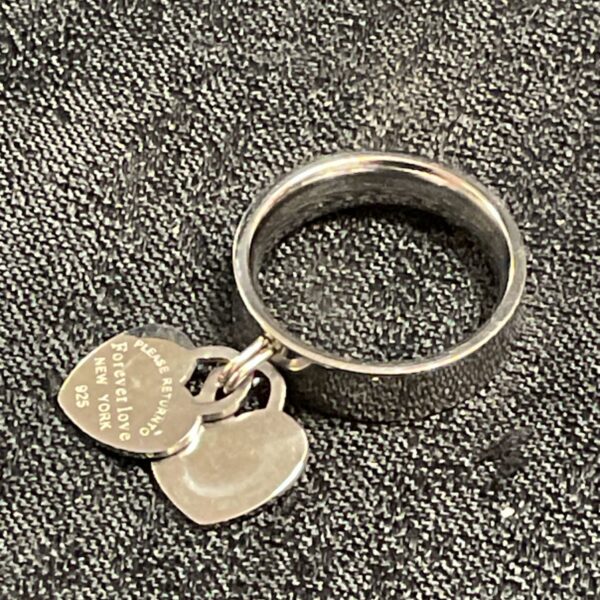 Silver tone Tiffany style Forever Love ring, size Q.