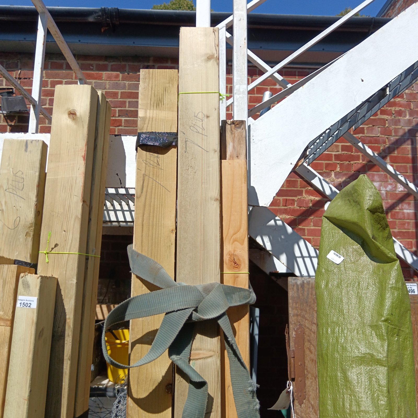 Three bundles of 7ft timber ready for construction projects.